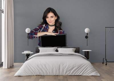 brunette young woman holding laptop Wall mural