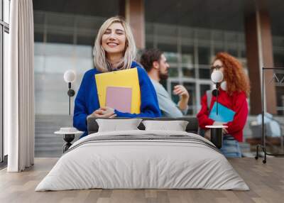 Cheerful young woman applying to university Wall mural