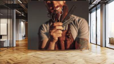 Crop man showing barber tools Wall mural