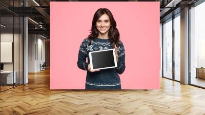 Friendly woman demonstrating modern tablet Wall mural