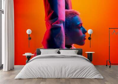 Futuristic woman raising arms under neon light Wall mural