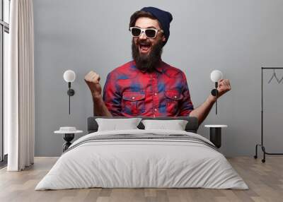 happy hipster man with beard exults Wall mural