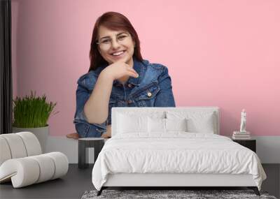 Happy overweight woman at white table  Wall mural