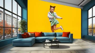 Stylish child smiling and dancing Wall mural