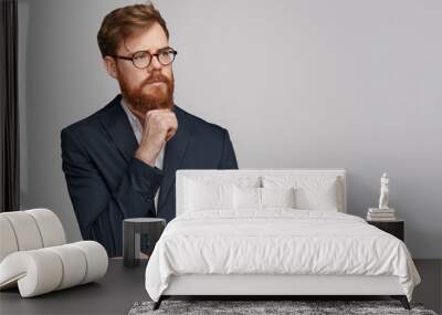 Thoughtful businessman looking away Wall mural