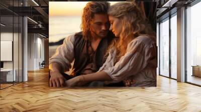 A handsome man in love with a beautiful woman with long blonde hair, sitting on the beach, with ocean in background , pirate couple in vintage clothing Wall mural