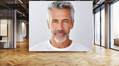 Beautiful portrait of a 50s mid aged mature man looking at camera isolated on white background Wall mural