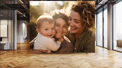 Family portrait of a lesbian couple holding their toddler kid in their arms Wall mural