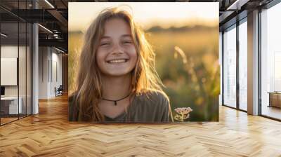 Happy 15 years old teenage girl portrait in middle of beautiful nature of a field with copy space Wall mural