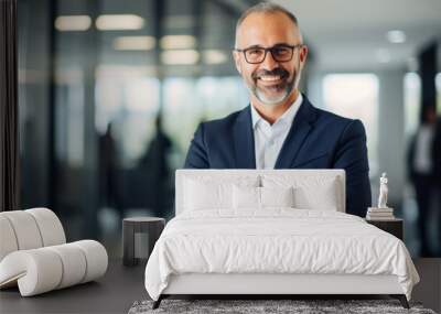 Happy middle aged business man standing in office arms crossed wearing a suit and shirt Wall mural