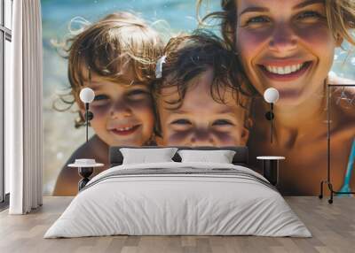 Happy mother and two children family at the beach on hot summer day Wall mural