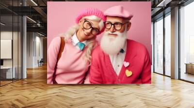 Married happy couple of elderly pensioners in retro pastel clothings with heart shapes representing love and romance between old people Wall mural