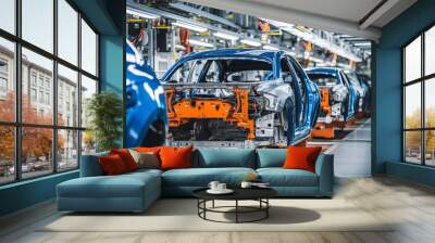 Mass production assembly line of modern cars in a busy factory Wall mural