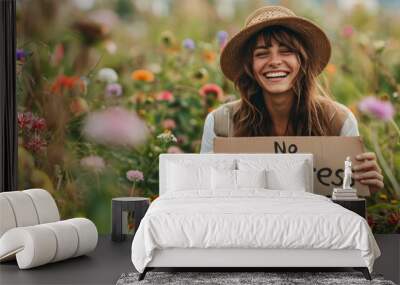 No stress concept image with a relax hippie woman in middle of beautiful nature holding a sign with written words No stress Wall mural