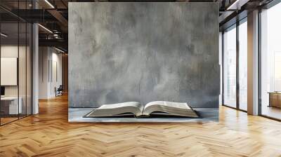 Open holy book on grey surface and copy space banner background Wall mural