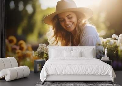 Portrait of a beautiful young European woman gardener on sunny day Wall mural