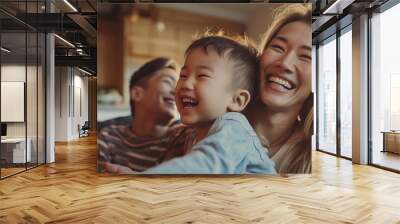 Portrait of a Korean family with parents and their young toddler kid at happy home Wall mural