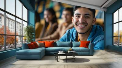 Portrait of a latino american happy university student sitting in a college lecture hall Wall mural