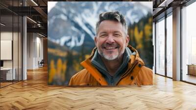 Portrait of a mature male in winter outdoor , happy man in scenic mountain and forest landscape Wall mural