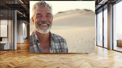 Portrait of a mature man on adventure holidays in desert , the male smiling face show how much he is enjoying this travel Wall mural