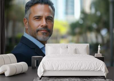 Portrait of a mature middle-aged hispanic latino man in suit outdoors with a blurry business center in backdrop Wall mural