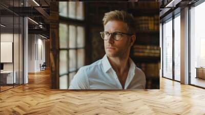 Portrait of an handsome blond hair caucasian white man in his 40s wearing glasses with formal slick hairstyle and smooth face wearing a white shirt in a luxury ancient library Wall mural