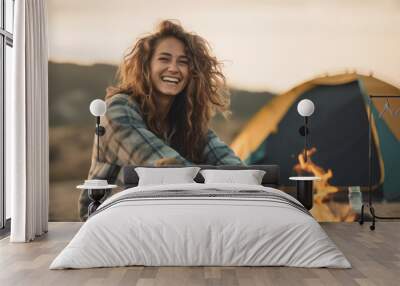 Portrait of happy captivating young woman enjoying camping in a beautiful outdoor landscape with natural lighting Wall mural