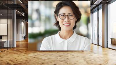 Pretty 45 years old Korean business woman, wearing glasses, formal slick hairstyle, in a modern office building, wearing white shirt, beside a huge window Wall mural