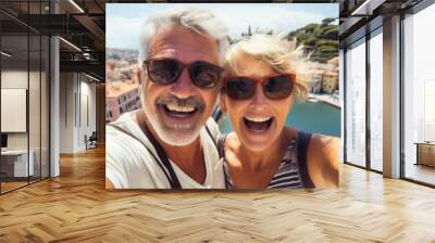 Selfie picture of a happy married mature couple of tourists visiting south Europe , senior man and woman enjoying weekend vacation Wall mural