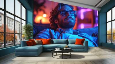 Single man sitting alone on his sofa at home looking at camera like if he is watching a screen or television at night , single male or divorced guy concept image Wall mural