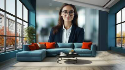 Smiling elegant confident young professional business woman , female proud leader, smart businesswoman lawyer or company manager executive looking at camera standing in office Wall mural