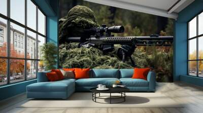 Special forces sniper soldier wearing ghillie suit laying on ground hiding with sniper gun Wall mural