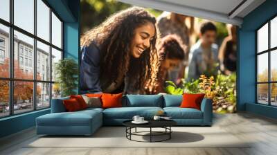 Teen girls at a community garden, planting and gardening together Wall mural