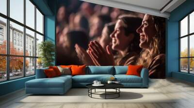 Woman in a audience in a theater applauding clapping hands. cheering and sitting together and having fun Wall mural