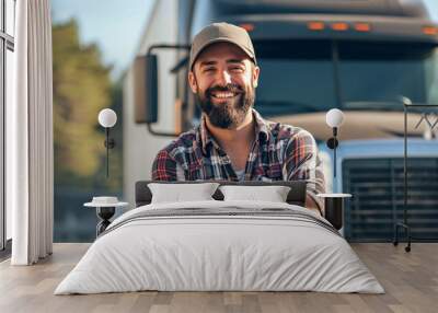 Young male truck driver standing in front of his truck, arms crossed, smiling at the camera, bearded man, wearing a hat Wall mural