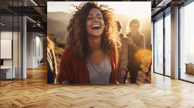 Young woman leading a group of people in laughter yoga session on a mountaintop at sunrise, their laughter echoes through the serene landscape as they embrace the healing power of laughter and nature Wall mural