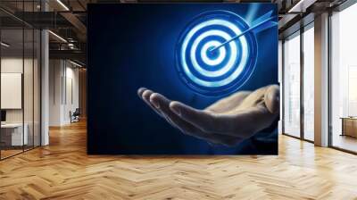 Businessman holding a target with an arrow, symbolizing success and achieving goals in digital marketing Wall mural