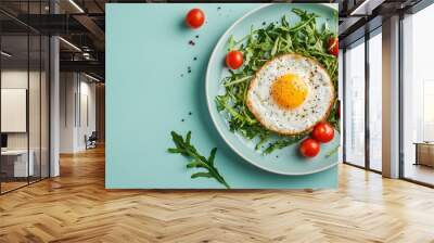 Fried eggs with vegetables on a plate. A bright healthy breakfast Wall mural