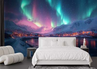 The beautiful northern lights over the icy road illuminate the snowy village. A magical polar night. Wall mural