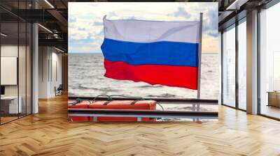 Russian flag waving on the deck of the ship against the background of the sea Wall mural