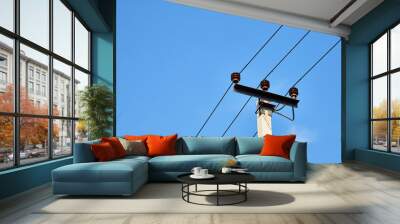 Electric power lines and wires with blue sky. Support of power lines in a nice day Wall mural