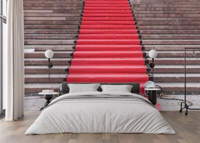 Red carpet over grey concrete stairs. Perspective ascending Wall mural