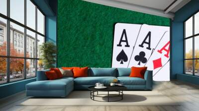 Set of four aces on the green table Wall mural