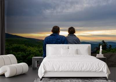 Couple Looks Out Over Sunset Falling on Blue Ridge Wall mural