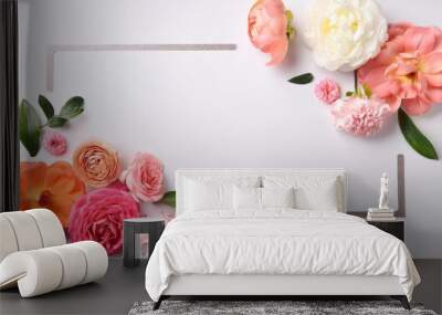 creative layout made with beautiful flowers on white background Wall mural