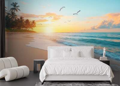 A high-angle view of a pristine beach bathed in the golden light of sunset, with tall coconut trees gently swaying in the breeze, soft waves rolling in from the ocean Wall mural