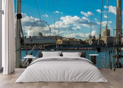 Landscape of the Dock Uno of Málaga. Views of the sea and port with details and ropes of a boat, a noria and beautiful buildings in a shiny day, December 2017. Wall mural