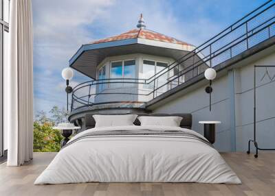 Clouds reflect in the windows of a prison's guard tower in Kingston Ontario Canada. Wall mural