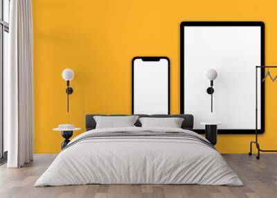 Modern black tablet and smart phone with blank white screen isolated on yellow background. space for text.  Wall mural