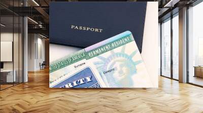 United States passport, social security card and permanent  resident (green) card on white background. Immigration concept Wall mural